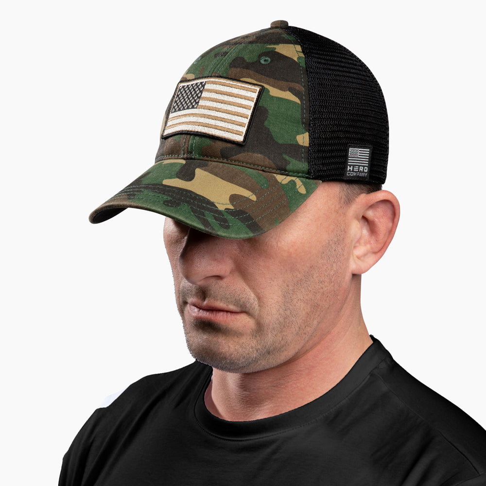 The Hero Company American Flag Hat - Camo - Helps Pair Veterans With A Service Dog or Shelter Dog