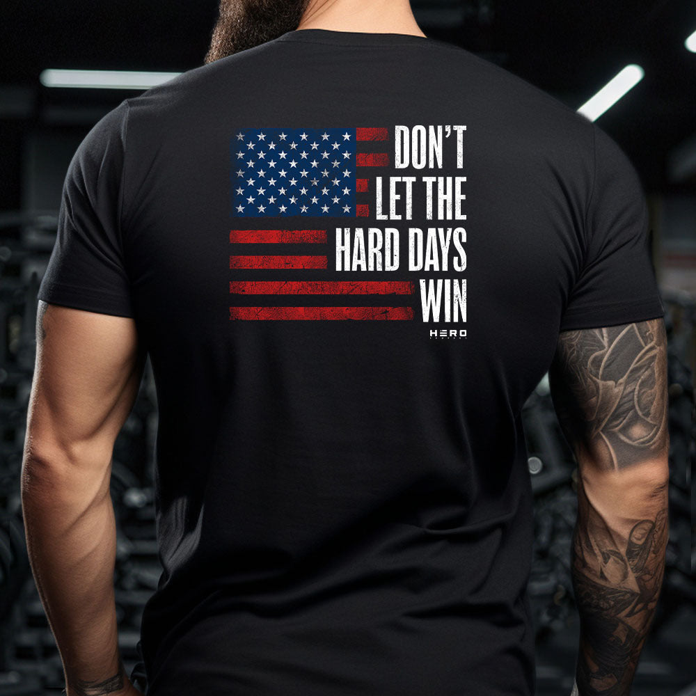 Hero Company Men's Don't Let The Hard Days Win Flag Black Tee - Shepherd Black Tee - Helps Pair Veterans With A Service Dog or Shelter Dog
