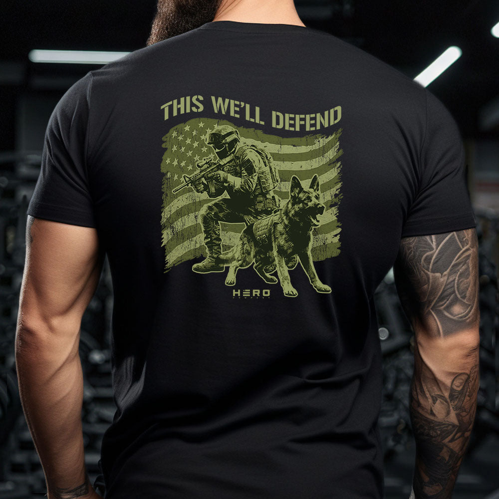 Hero Company Men's This We'll Defend Black Tee - Helps Pair Veterans With A Service Dog or Shelter Dog