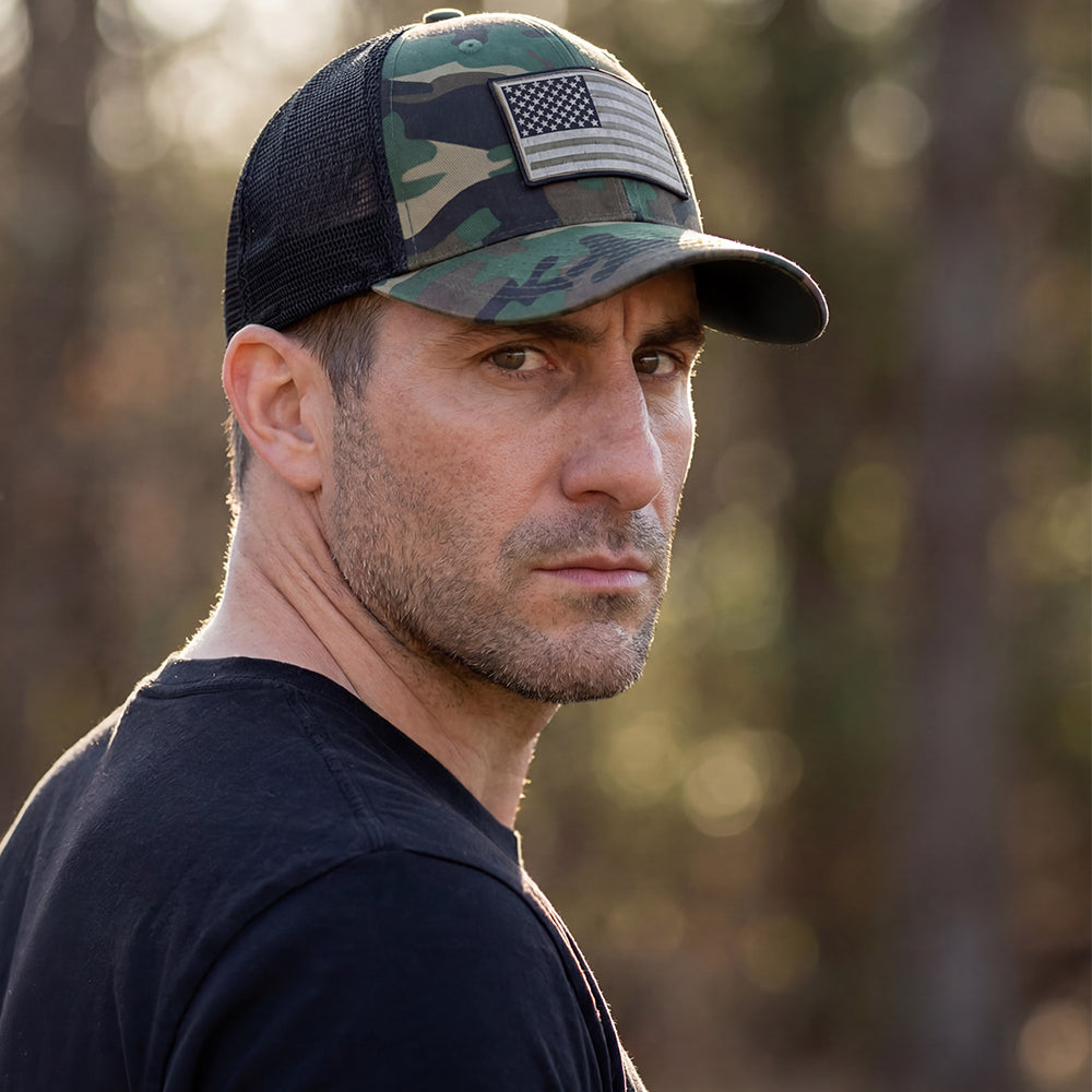 The Hero Company American Flag Hat - Camo - Helps Pair Veterans With A Service Dog or Shelter Dog